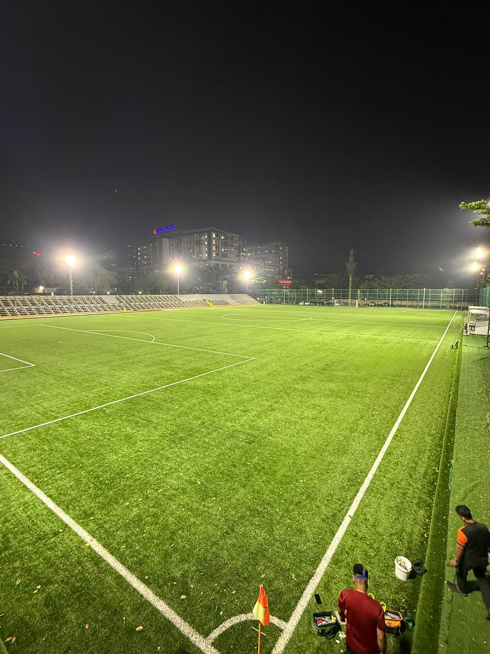 Corner view of the SJM1 Arena football turf with bright evening lights