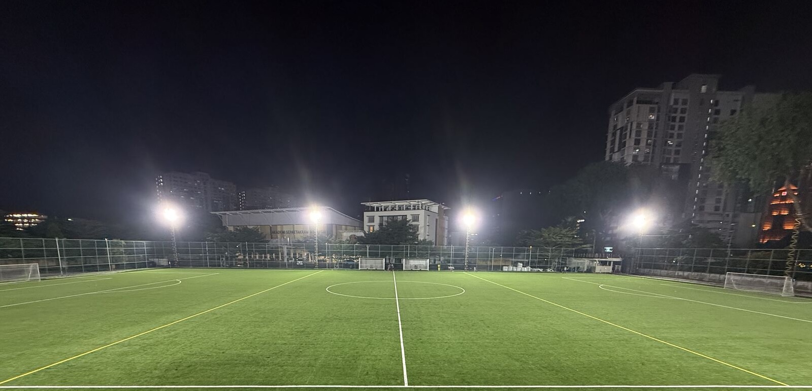 Full view of the SJM1 Arena football turf under bright floodlights at night
