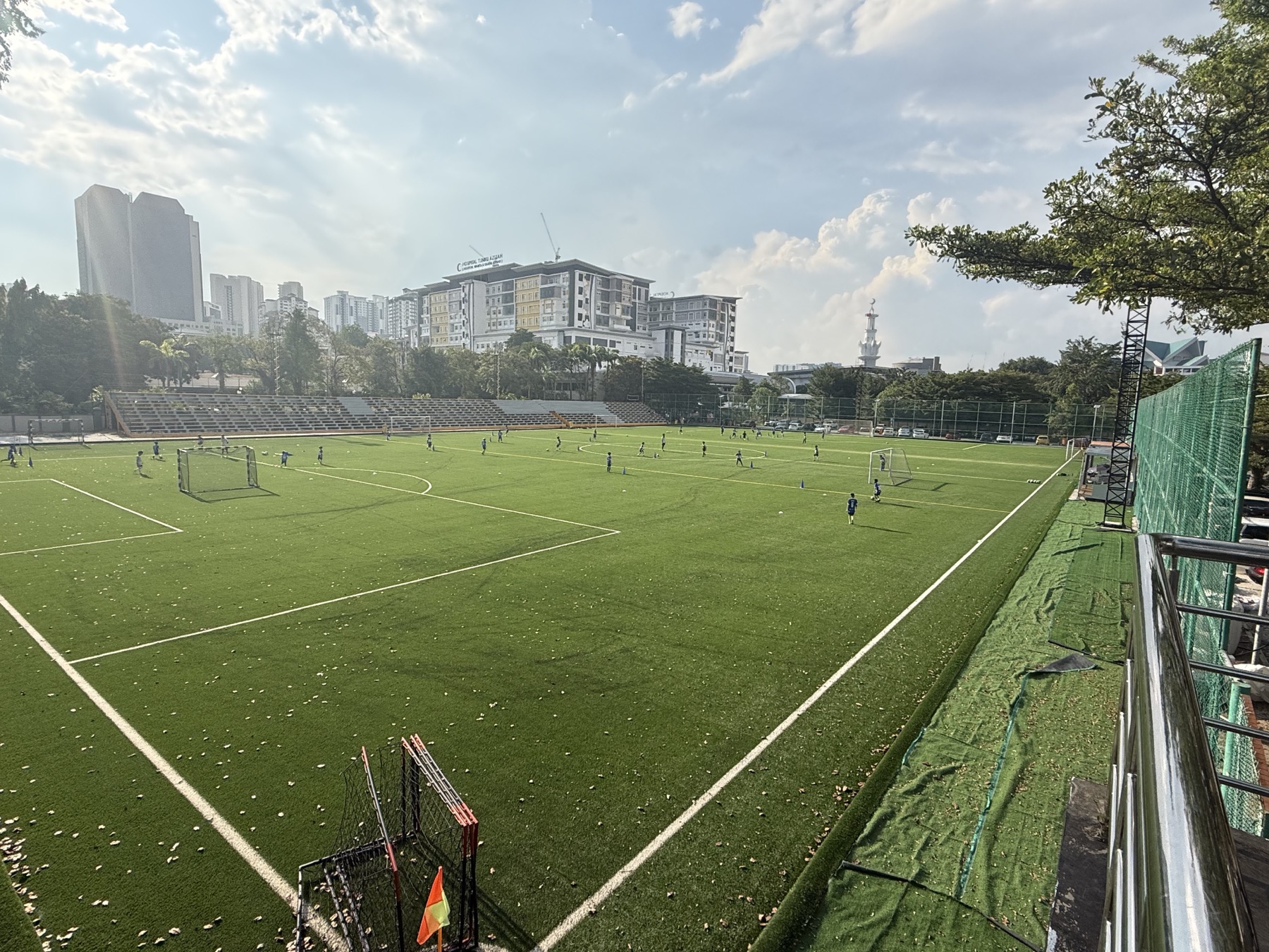 Football players training at SJM1 Arena during the day